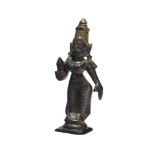 A small South Indian bronze figure of Parvati, 19th century, on a rectangular base, holding a