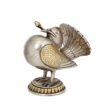 A silver gilt bird, India, 19th century, on a round raised base, shown with puffed out breast and