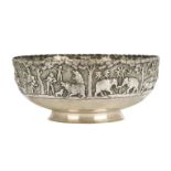 A repousse work silver bowl by A. Bhicajee & co, Bombay, circa 1910, on a short splayed foot, the