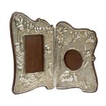 An Art Nouveau 'Japanesque' silver and mahogany hinged double photograph frame Mark of E. Mander &