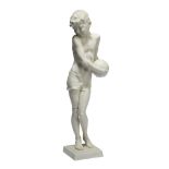 Karl Tutter (1883-1969), a Hutchenreuther porcelain figure of a boy holding a football c.1948,