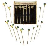 A set of twelve silver gilt 'cockerel' cocktail sticks c.1930, Stamped Sterling Each slender stick