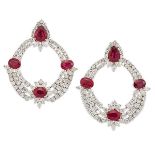 A pair of ruby and diamond earrings, each of flexible garland design, the top section composed of