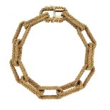 An 18ct gold bracelet, of rope textured fetter-link design, London import marks, 1967, 68.5g, 20cm