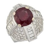 A ruby and diamond ring, of bombe cluster design, the single claw-set oval ruby weighing