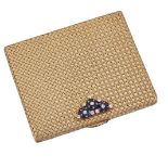 A diamond and sapphire-set compact, the rectangular compact of basket weave design with internal