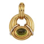A two colour, peridot pendant, by Boucheron, the two colour reeded pendant with central cabochon-cut