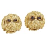 A pair of novelty dogs head earrings, each modelled as a dog's face with engraved detail and