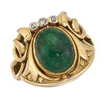 An emerald and diamond ring, the central collet-set cabochon emerald in Art Nouveau style mount,