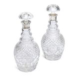 A pair of cut glass decanters with silver collars, London c.1985, Garrard & Co Ltd., with associated