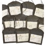 A collection of approximately one hundred and fifty sheet metal wine cellar label holders, 20th