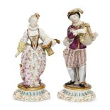 A pair of Continental figures of a boy and girl, representing Music and Literature, probably