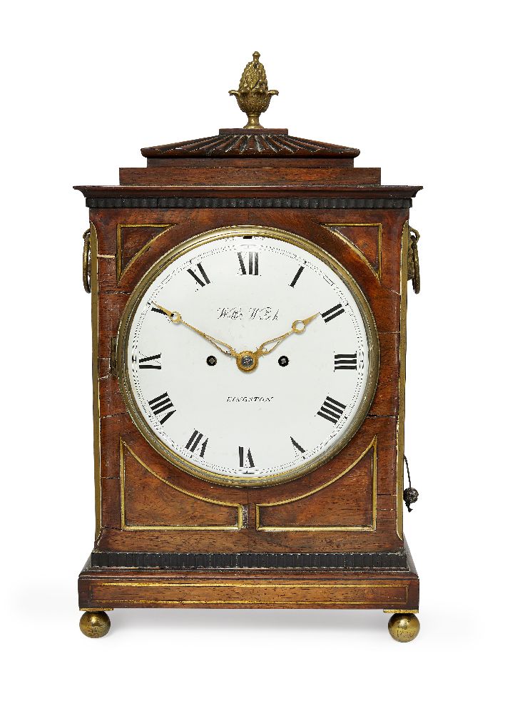 A Regency rosewood and brass inset bracket clock by William Welch, with brass pineapple finial on