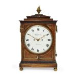 A Regency rosewood and brass inset bracket clock by William Welch, with brass pineapple finial on