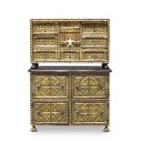 A Spanish walnut vargueno chest, 17th century, with gilt metal and red velvet mounts, the front with