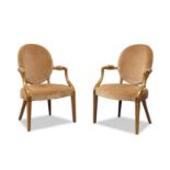 A pair of Edwardian mahogany and boxwood strung armchairs, in the Georgian taste, the oval back