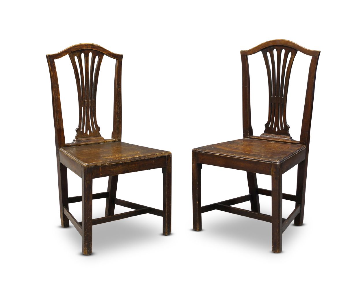 A pair of George III mahogany dining chairs, the serpentine top rails above pierced waisted splats