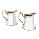 A pair of silver jugs, Sheffield c.1935, Frank Cobb & Co Ltd., of flared form with scroll handle,