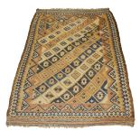 A Caucasian Kelim, early 20th century, with geometric motifs in step edged lozenged pattern field,