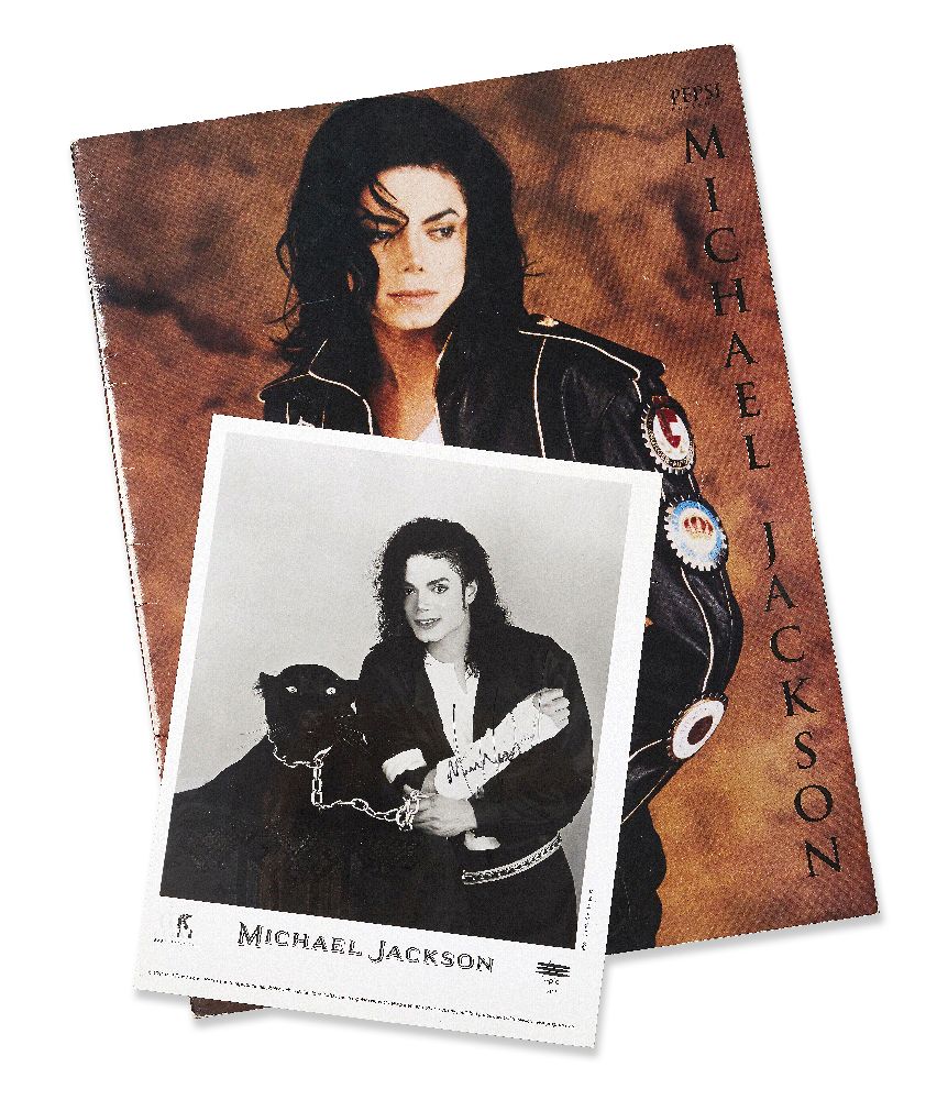 Michael Jackson, American, 1958-2009, a signed photograph of Michael Jackson with a black panther,