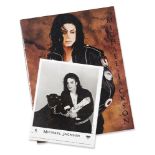Michael Jackson, American, 1958-2009, a signed photograph of Michael Jackson with a black panther,