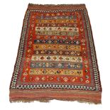 A West Persian Kelim, mid-20th century, with polychrome lozenge motifs in striped field with striped