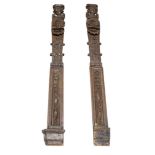 A pair of Continental carved figural oak pilasters, 19th century, with angel heads with entwined