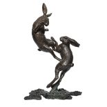 Michael Simpson, British, b.1951, a large bronze group of Boxing Hares, edition 2/21, inscribed to