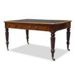 An early Victorian mahogany partner's desk, the rounded rectangular top inset with dark green