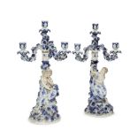 A pair of Sitzendorf porcelain four light candelabra, late 19th/early 20th century, the bases