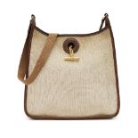 Hermes: an Hermes Vespa natural canvas and brown leather shoulder bag, with gold plated hardware,