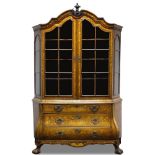 A Dutch walnut and floral marquetry display cabinet on chest, 19th century, the arched moulded