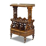 A Victorian rosewood Canterbury, the rectangular top with pierced brass gallery, on shaped and