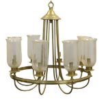 A pair of polished metal eight light chandeliers, 20th century, each with Neoclassical moulding to