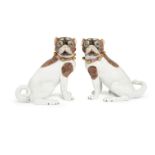 A pair of Dresden porcelain models of pugs, 20th century, modelled seated on their haunches, with