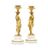 A pair of French gilt-bronze figural candlesticks, late 19th century, modelled as boy and girl