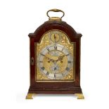 A George III mahogany bracket clock, by George Hershaw, the arched top with brass carrying handle,