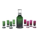 A St Louis coloured glass liquor set, French, modern, acid etched factory marks, comprising a