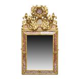 A French Louis XIV style verre églomisé and carved giltwood mirror, 19th century, with an ornate