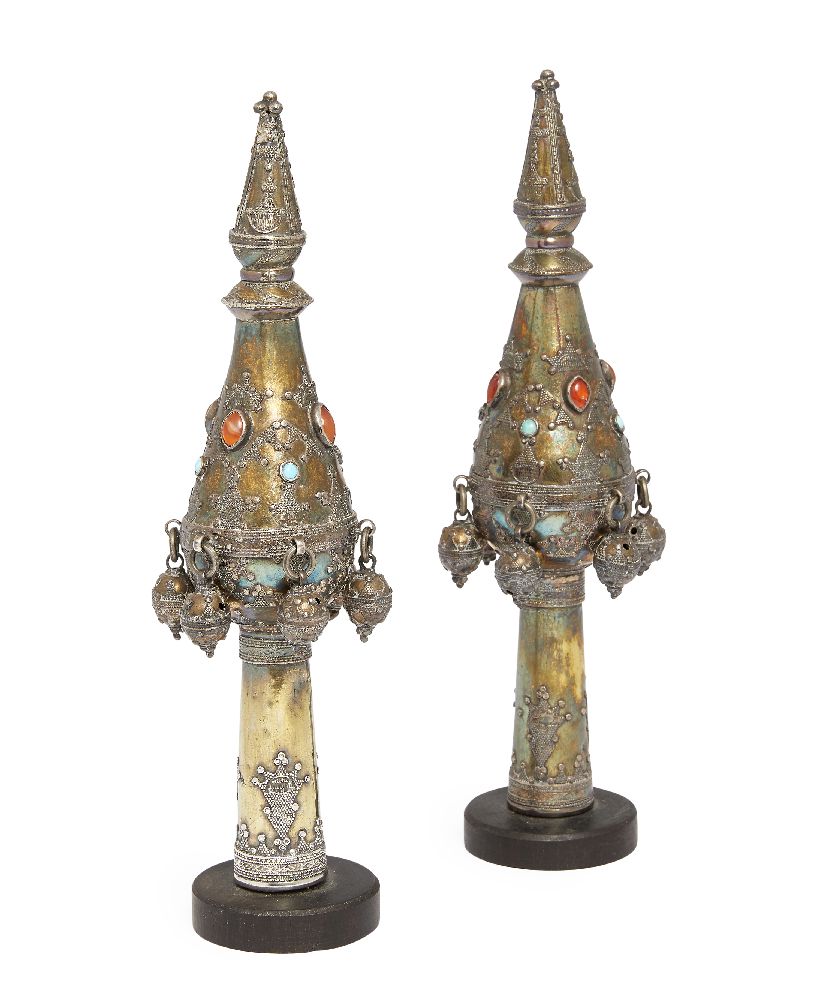 A pair of East European brass Torah scroll finials, 19th century, applied with carnelian and