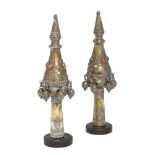 A pair of East European brass Torah scroll finials, 19th century, applied with carnelian and