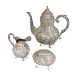 A Danish silver coffee pot and cream jug, early 20th century, in the rococo style with repousse