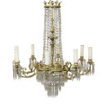 A pair of eight light gilt metal and lustre hung chandeliers, 20th century, with central baluster