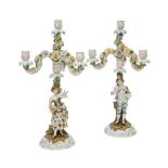 A pair of German porcelain floral-encrusted four light candelabra, probably Sitzendorf, late 19th/