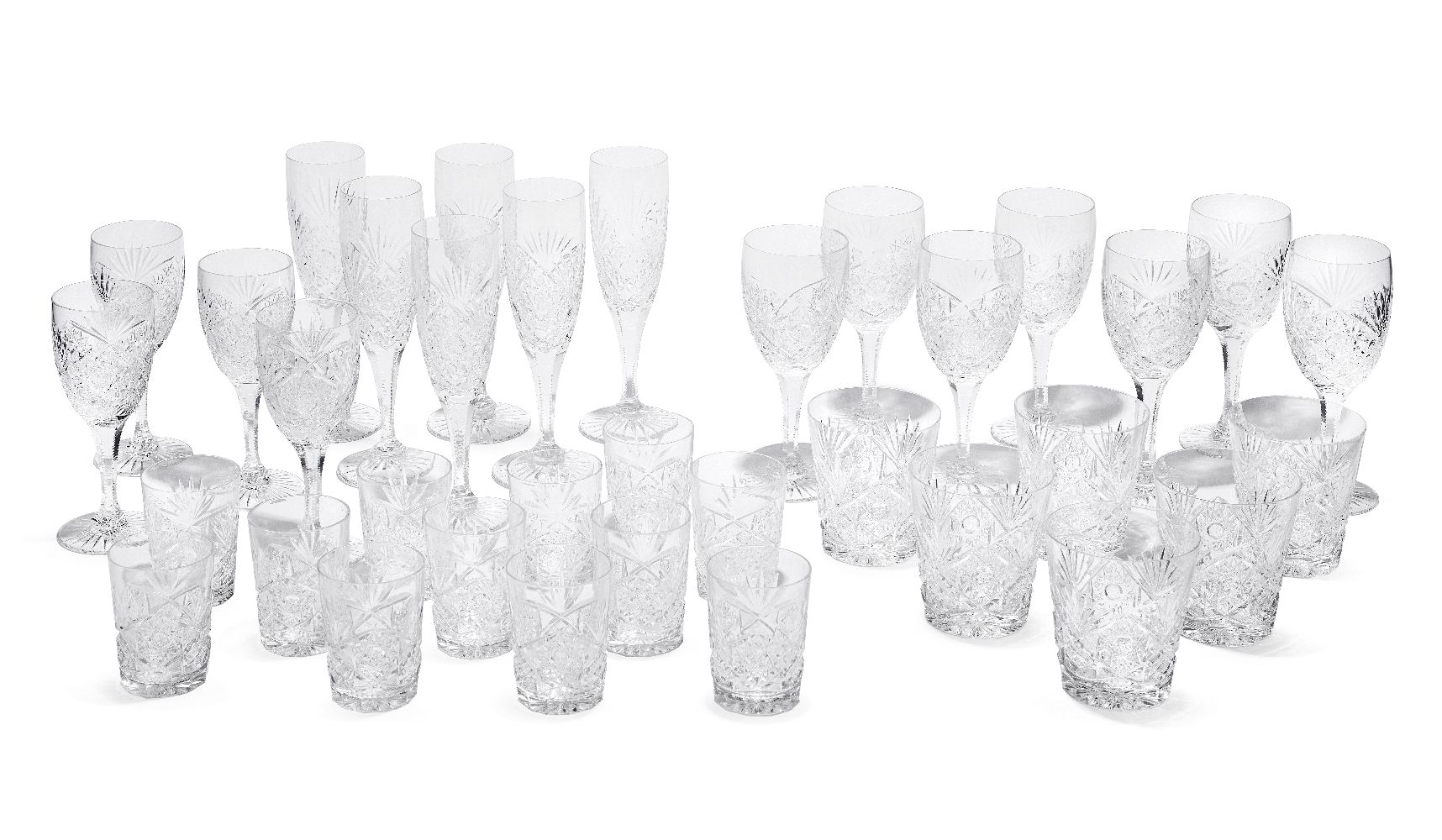 A part suite of drinking glasses and tumblers, in the style of Stuart crystal, 20th century, to