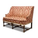 A Flemish walnut settee, 19th century, the straight back above downward swept armrests,