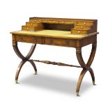 An Edwardian yew wood desk, the top with stepped superstructure comprising eight drawers, above