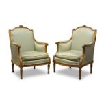 A pair of Louis XVI walnut bergère armchairs by Georges Jacob, with foliate carved crest, above