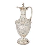 An Edwardian silver wine ewer, Sheffield c.1902, Atkin Brothers, with repousse scrolling flowers,
