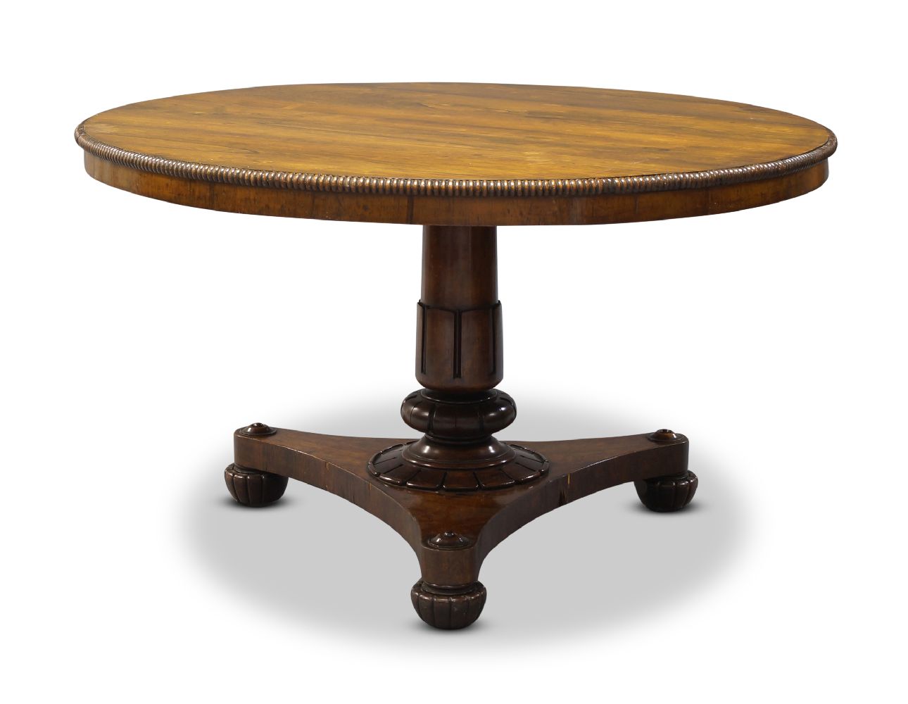 A William IV rosewood tilt top breakfast table in the manner of Gillows, the circular top with